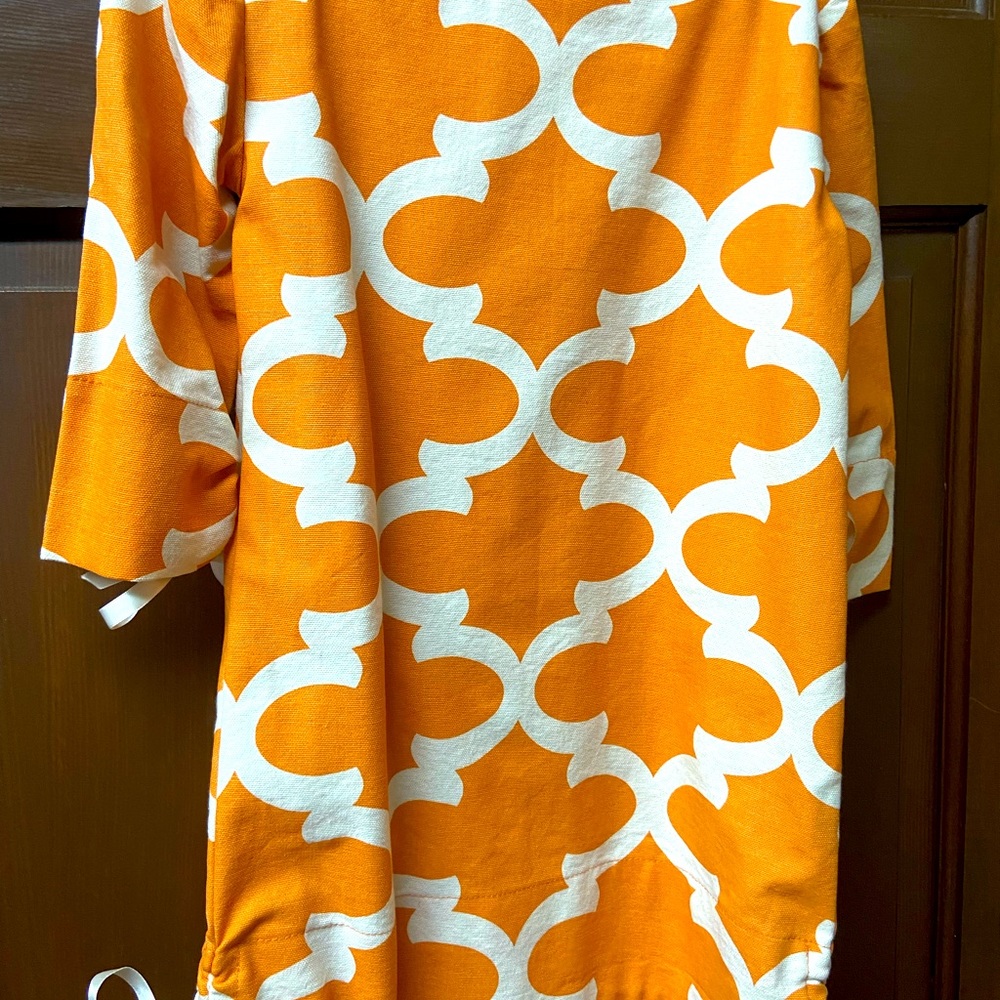 Beautiful, new orange and white dress.